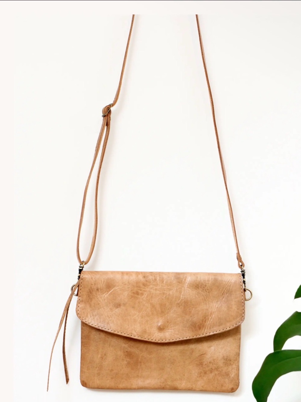 Light Tan Leather Crossbody Bag with Tassel Accent